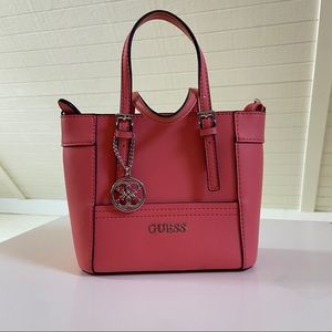 Guess bucket bag with removable crossbody strap.